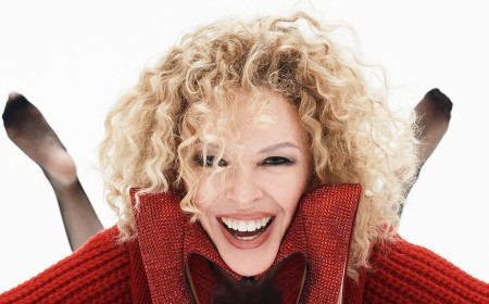 Kylie Minogue brings back her 80s corkscrew perm as she celebrates the 25th anniversary of pop record Fever and discusses finally breaking the US