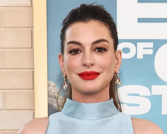 Anne Hathaway, 43, roasted over 'ridiculous' maternity outfit as she shows off baby bump at LA premiere