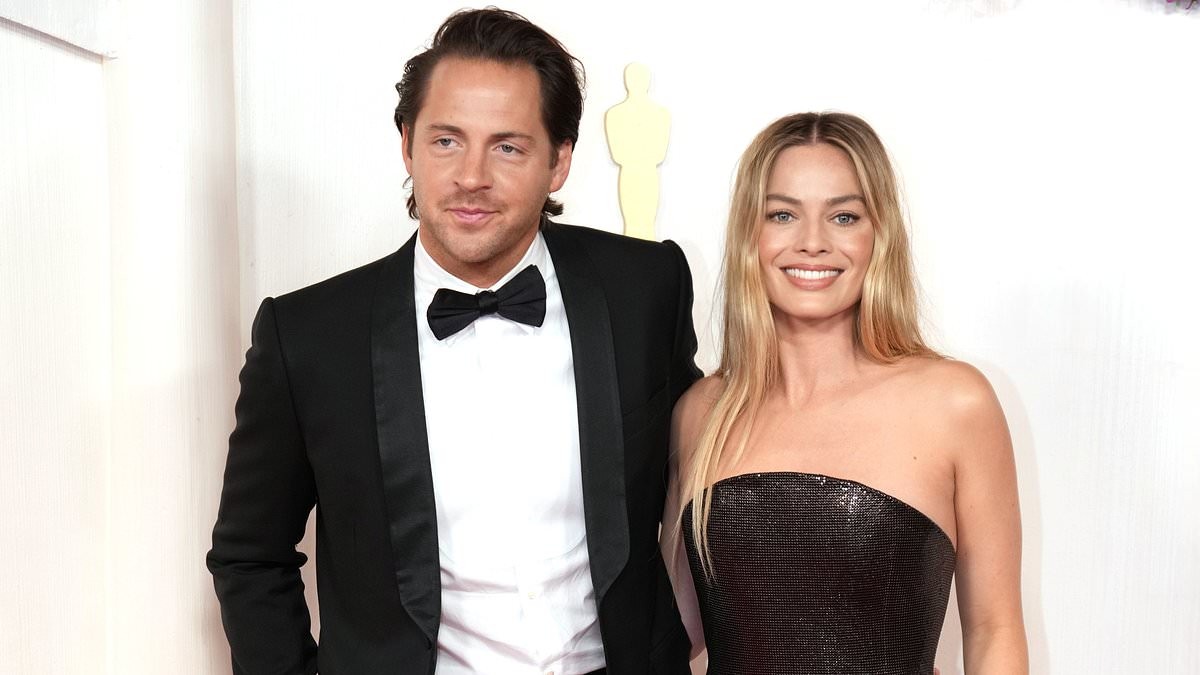 Margot Robbie drops her maiden name and starts using her British husband's surname a decade after tying the knot