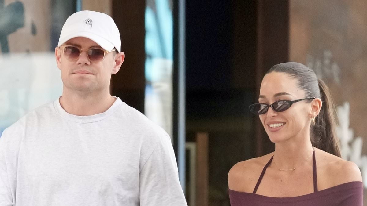 Smiles on the sidelines! Footy star Lachie Neale looks unfazed by Grand Final heartbreak as he steps out with girlfriend Emma Field in Brisbane following tribunal disaster