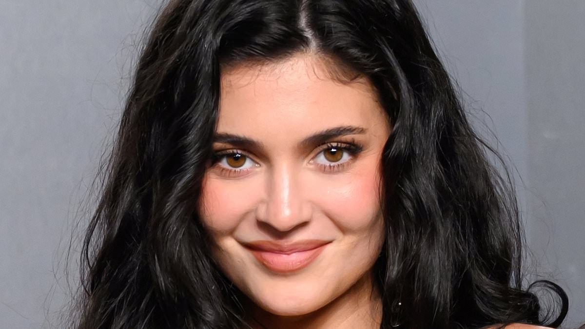 Kylie Jenner shows off boob job in black vinyl tube dress after confessing she wants to go even BIGGER
