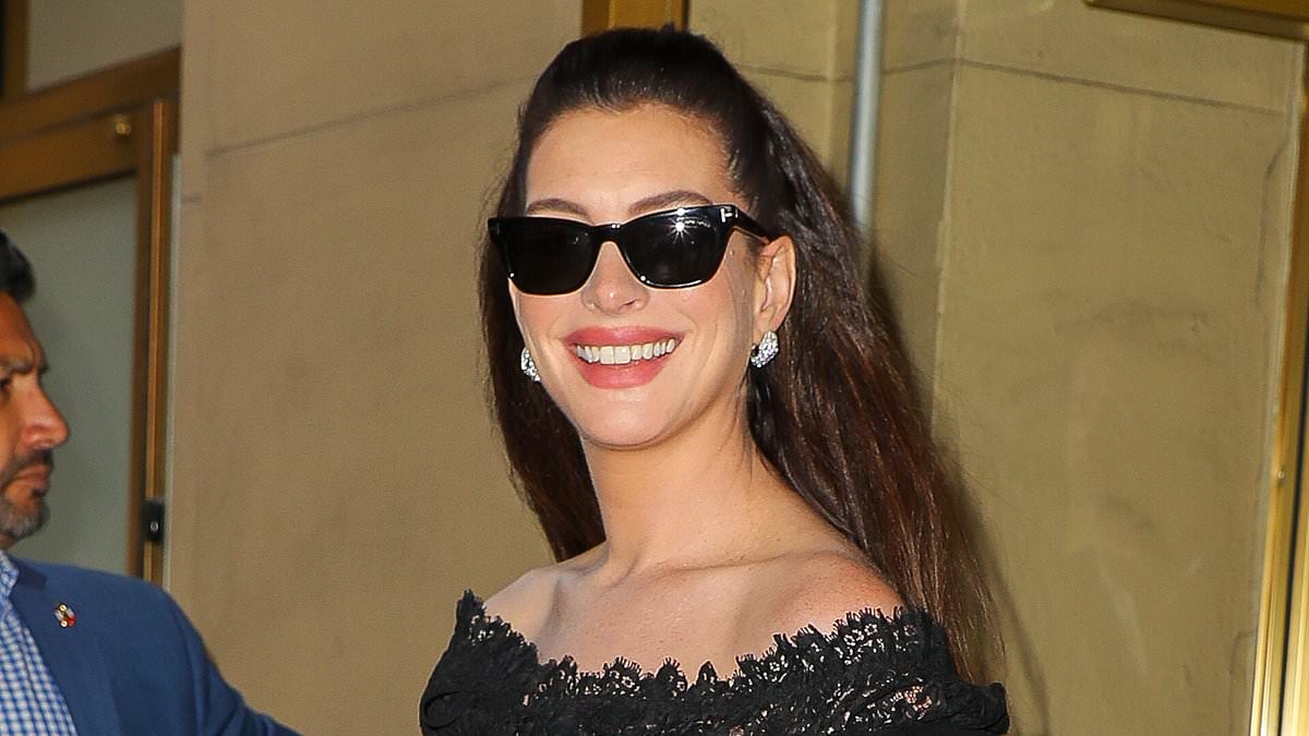 Anne Hathaway, 43, reveals her bump as she steps out in New York after missing Verity premiere in London due to being in her third trimester