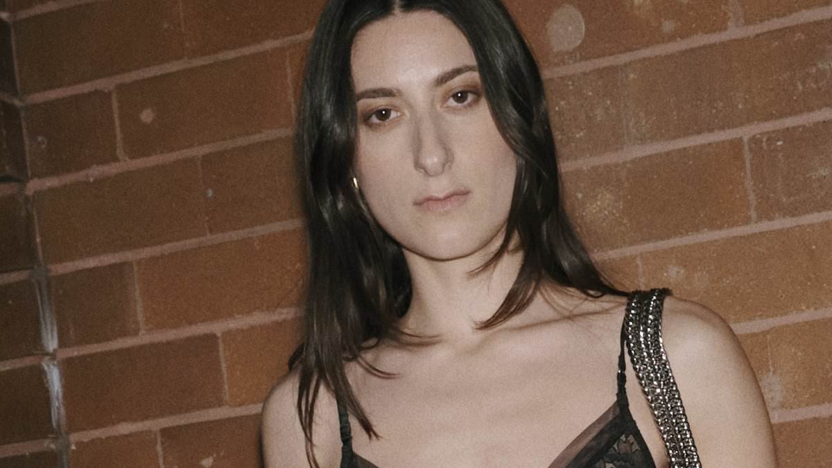 Daughter of one of Australia's most famous fashion designers - 'Queen of jeans' Bettina Liano - steps out on the Sydney social scene in a daring sheer top