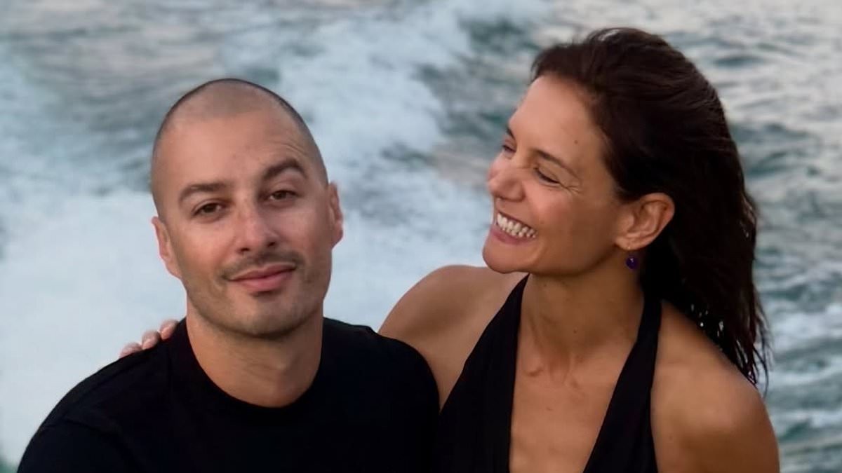 Katie Holmes, 47, slips into tiny white bikini on romantic boat ride with boytoy Jason Bard Yarmosky, 39, during Lake Como getaway