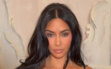 Kim Kardashian cozies up to boyfriend Lewis Hamilton before sharing romantic kiss in Paris... after revealing beau's bizarre nickname
