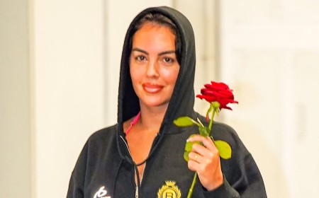 Newlywed Georgina Rodriguez clutches a red rose as she leaves Venice in a £1,000 Balenciaga hoodie