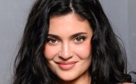 Kylie Jenner shows off boob job in black vinyl tube dress after confessing she wants to go even BIGGER