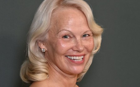 Makeup free Pamela Anderson, 59, steals the show in orange satin dress as she leads the stars at the amfAR Gala during Venice Film Festival