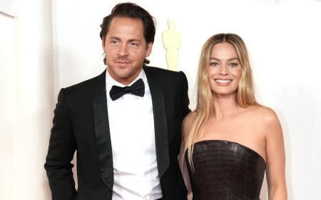 Margot Robbie drops her maiden name and starts using her British husband's surname a decade after tying the knot