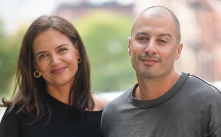 Katie Holmes, 47, and boyfriend Jason Bard Yarmosky, 38, pack on the PDA at NYFW