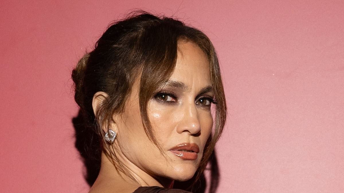 Jennifer Lopez, 57, stuns in a backless gown with a soaring split as she attends Naked Heart France charity dinner