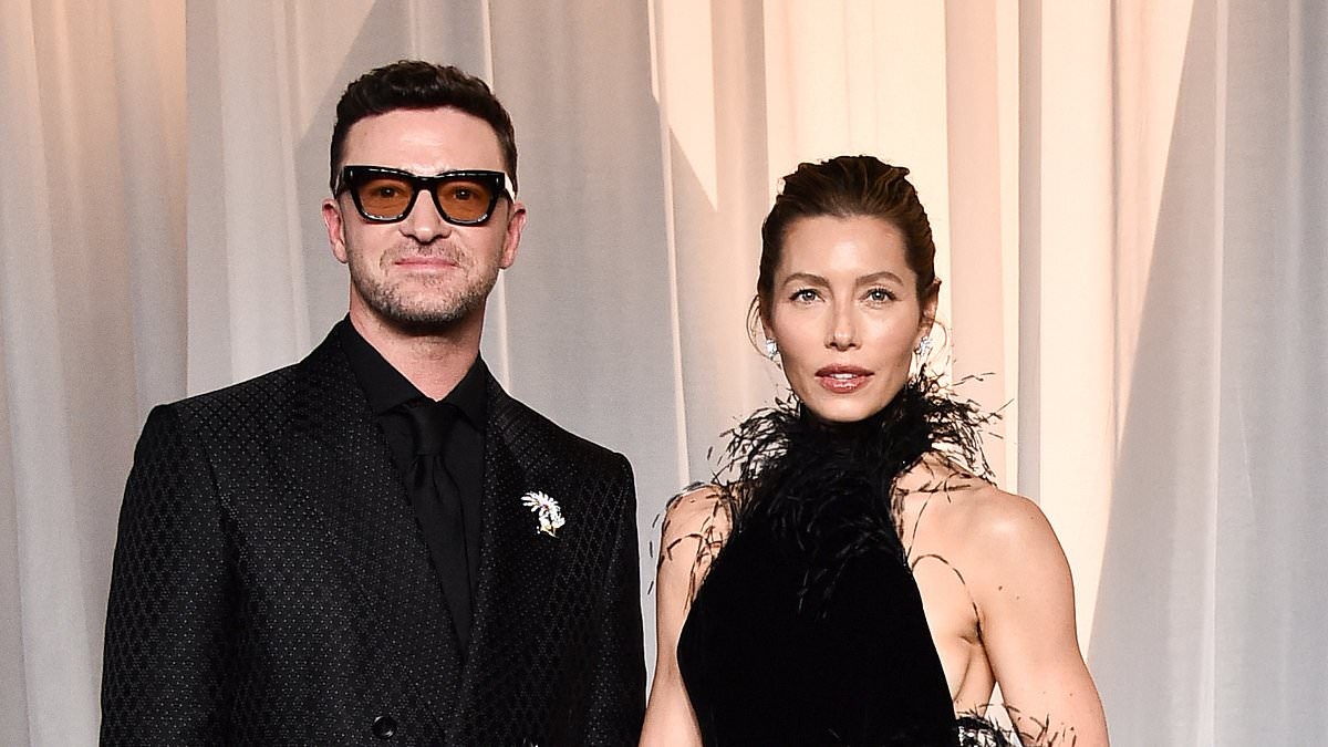 Jessica Biel makes bold arrival in dramatic feather gown as she joins husband Justin Timberlake at Academy Museum Gala