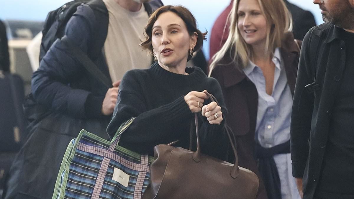 Zoë Foster Blake and husband Hamish cut casual figures as they jet out of NYC after partying at Andy Lee and Rebecca Harding's wedding