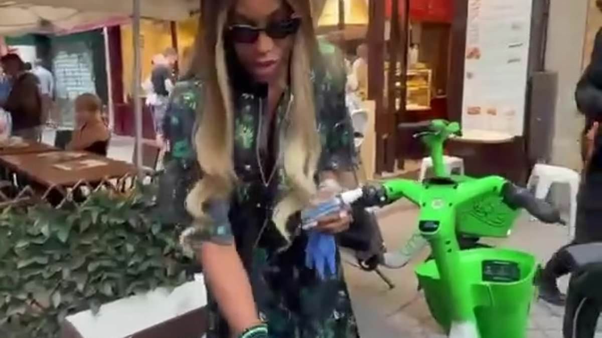 Naomi Campbell wipes down a Lime bike and wears latex gloves as she dodges germs while dashing between Paris Fashion Week shows