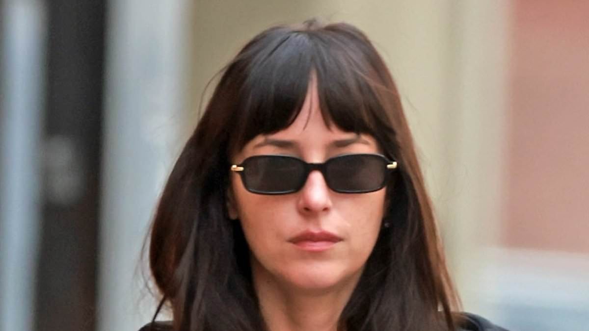 Dakota Johnson flashes her toned abs at the gym in LA... following steamy sex revelation amid MGK romance