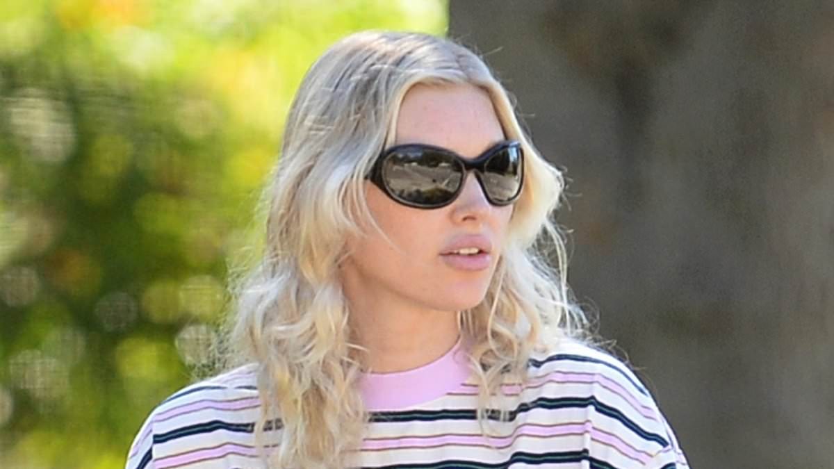 Elsa Hosk ditches runway glam for oversized t-shirt and jeans on LA outing with her daughters... after fans roasted her Victoria's Secret walk