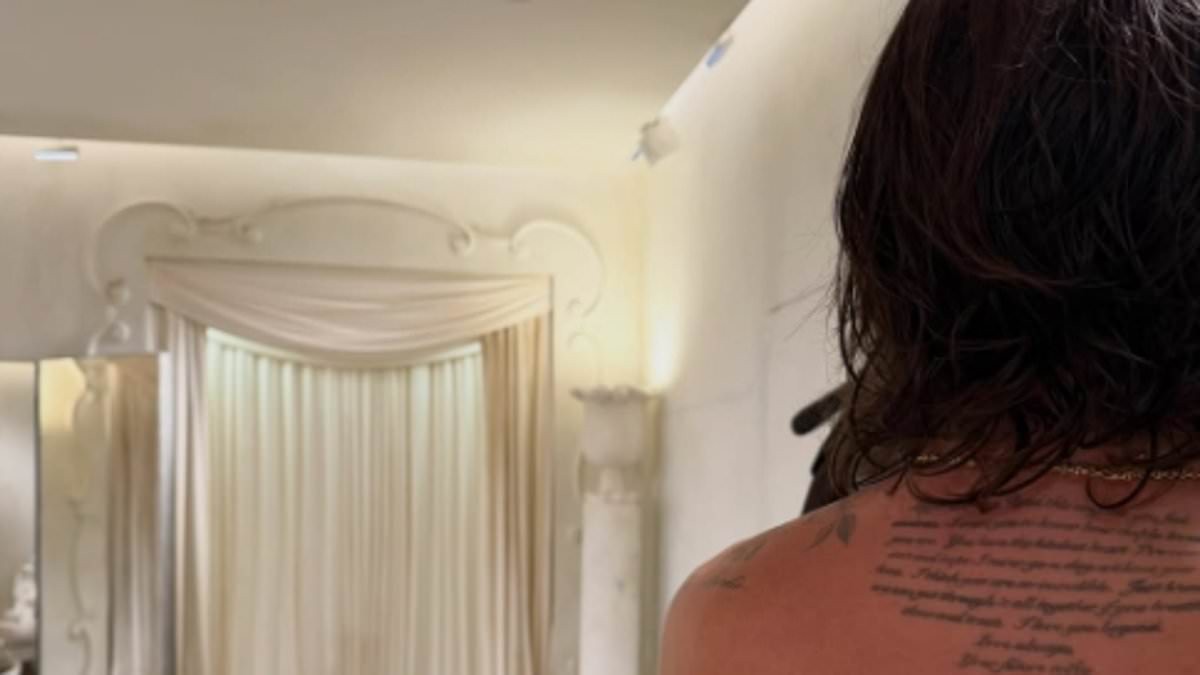 Brooklyn Beckham shows off his love letter tattoo tribute to Nicola Peltz as he poses shirtless at a Balenciaga fitting