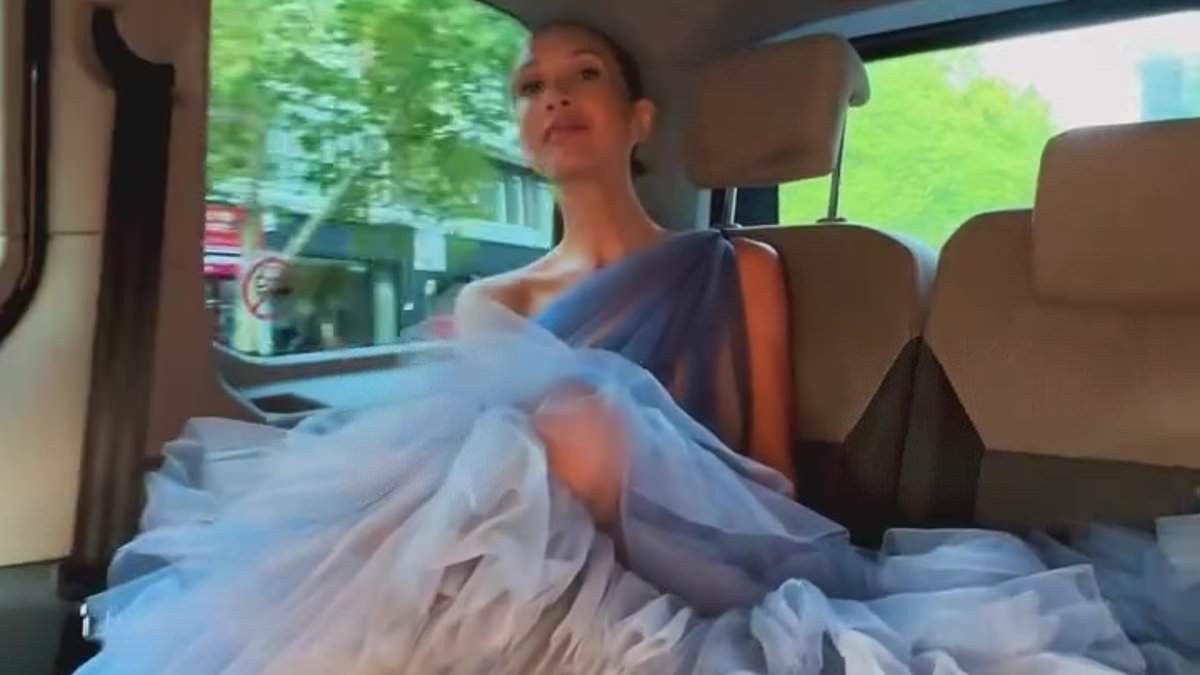 Myleene Klass struggles to fit her HUGE ballgown in the back of a cab as she works on her latest project after saying she's 'too busy' for Hear'Say and Liberty X reunion tour