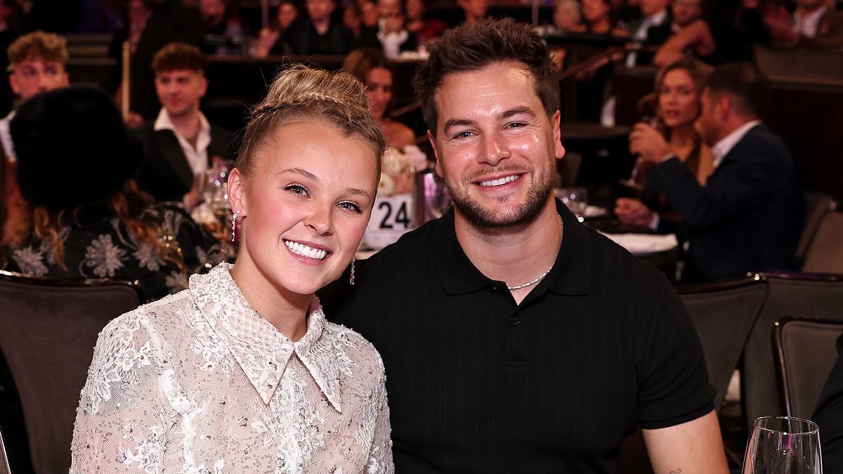 JoJo Siwa, 23, looks incredible in a white lace mini dress as she plants a kiss on boyfriend Chris Hughes, 33, at Gala of the Stars in LA