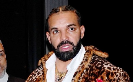Drake turns heads in a wild cheetah coat and red leather pants to ring in 40th birthday after rocking an eccentric poncho