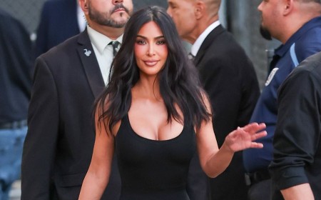 Kim Kardashian sizzles in plunging black dress at Jimmy Kimmel taping as she confesses to spying on OJ Simpson