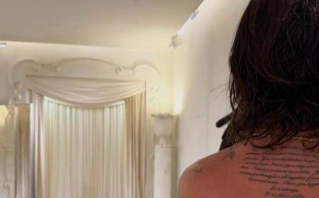 Brooklyn Beckham shows off his love letter tattoo tribute to Nicola Peltz as he poses shirtless at a Balenciaga fitting