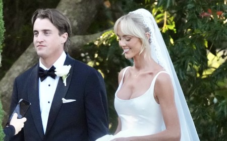 Annie Knight criticised for wearing a white wedding dress and a veil as she ties the knot with fiancé Henry Brayshaw: 'Scarlet would have been more appropriate'