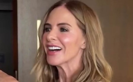 Trinny Woodall, 62, strips to her underwear as she larks around with her makeup artist