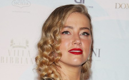 Carefree Amber Heard flips her hair and smiles in selfie snapped by daughter Oonagh, five, as her ex Johnny Depp sets major Hollywood comeback