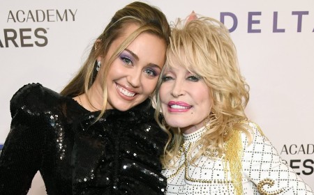Miley Cyrus brings sold-out LA concert to a standstill as she breaks down in tears paying tribute to late godmother Dolly Parton: 'Me and Dolly, we are eternal'