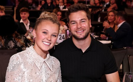 JoJo Siwa, 23, looks incredible in a white lace mini dress as she plants a kiss on boyfriend Chris Hughes, 33, at Gala of the Stars in LA