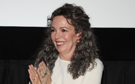 Olivia Colman, 52, displays her long grey locks as she joins Alexander Skarsgard at Wicker screening in New York after racy fantasy was labelled 'the year's weirdest rom-com'